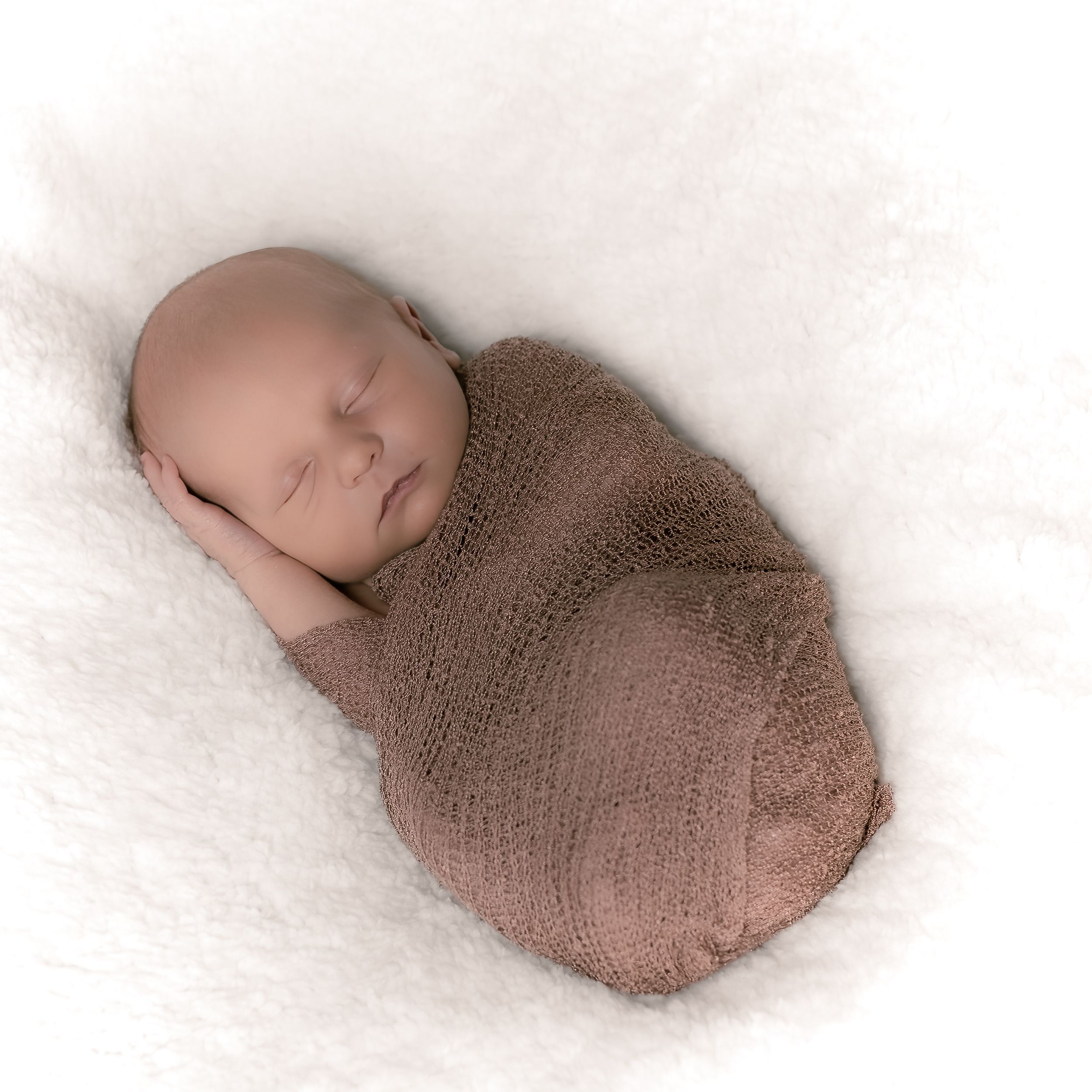 Swaddled Newborn Boy in Brown Wrap Portrait