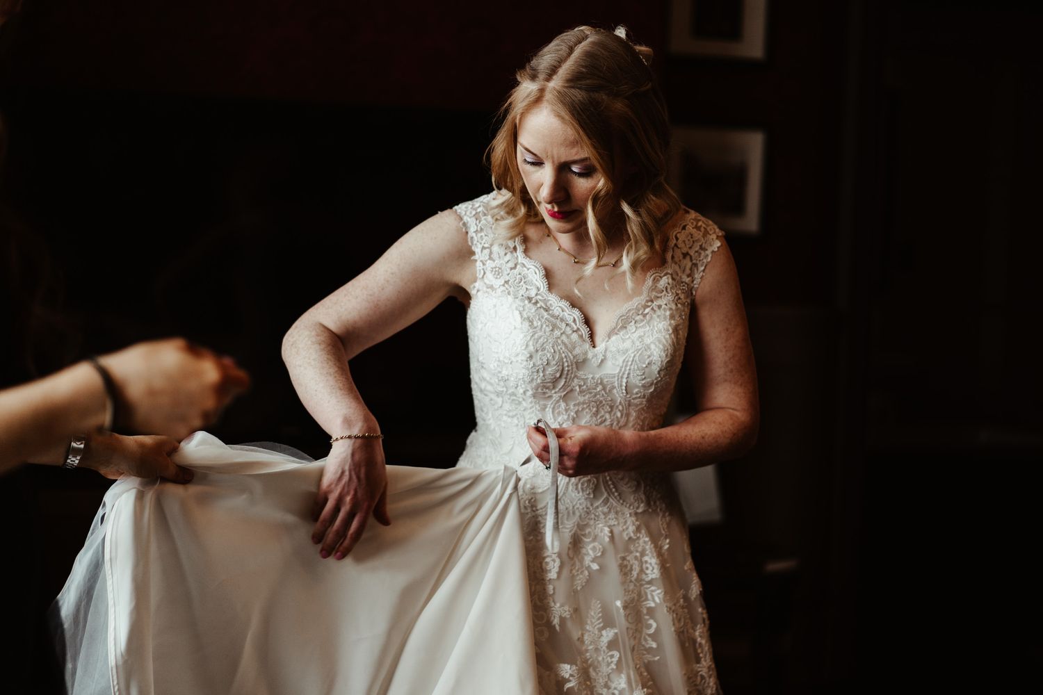 Bridal Morning Preparations in dramatic lighting Wedding Photography