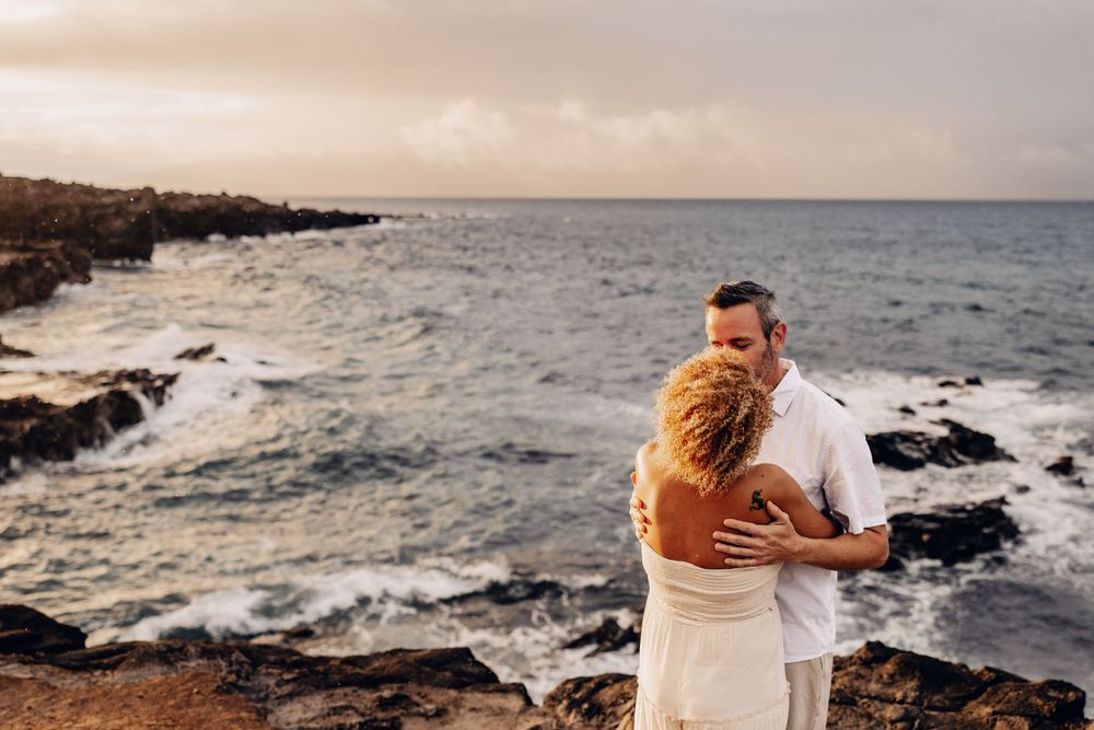 Artistic Candid Maui Photographer - A beautiful moment captured between a newly engaged couple on the beaches of Lahaina