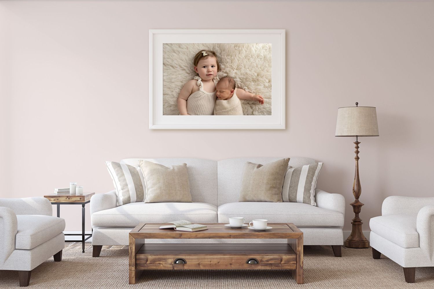 a framed newborn image on the wall of a lounge