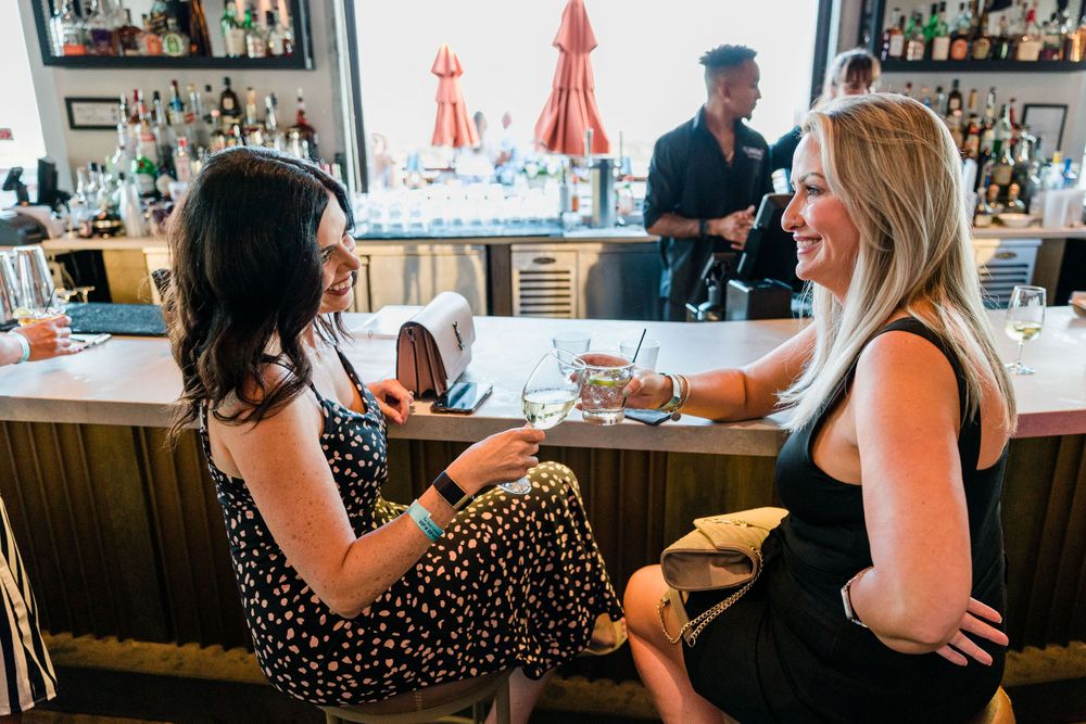 women drinking wine at bar, Event Photography, Melbourne, FL
