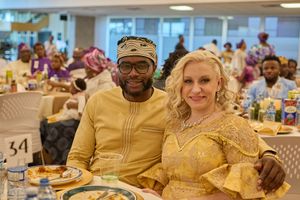 Wedding guests enjoying a celebratory meal at a reception table.