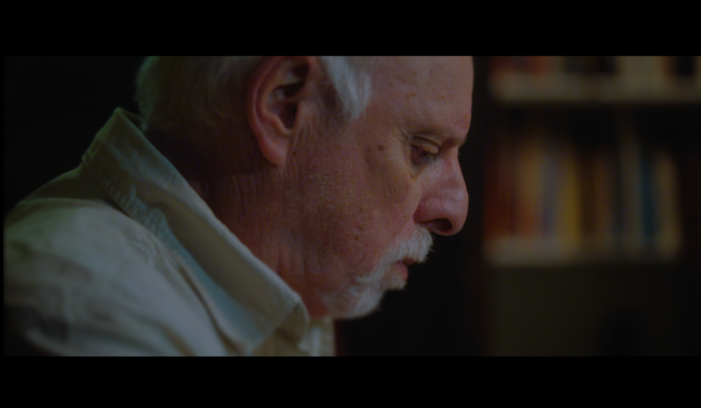 Close up shot of Alan Zeichner at dinner table of Short film video production