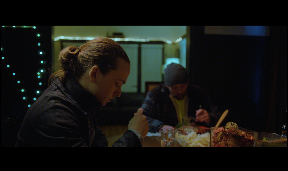 Sheldon Hall the main character at a dinner table in short film for Blendz Media Production Company and films