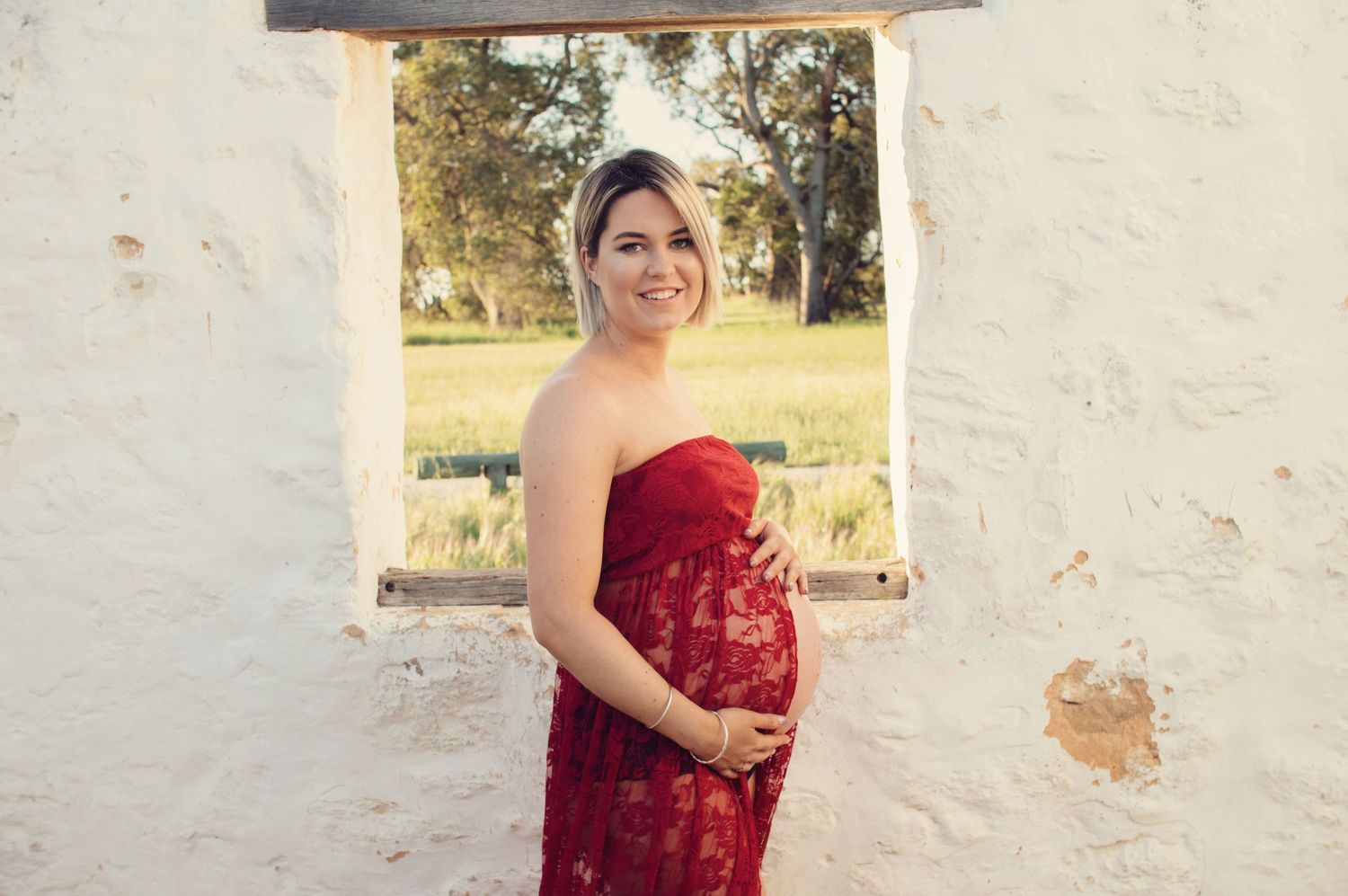 woman posing with pregnant belly
