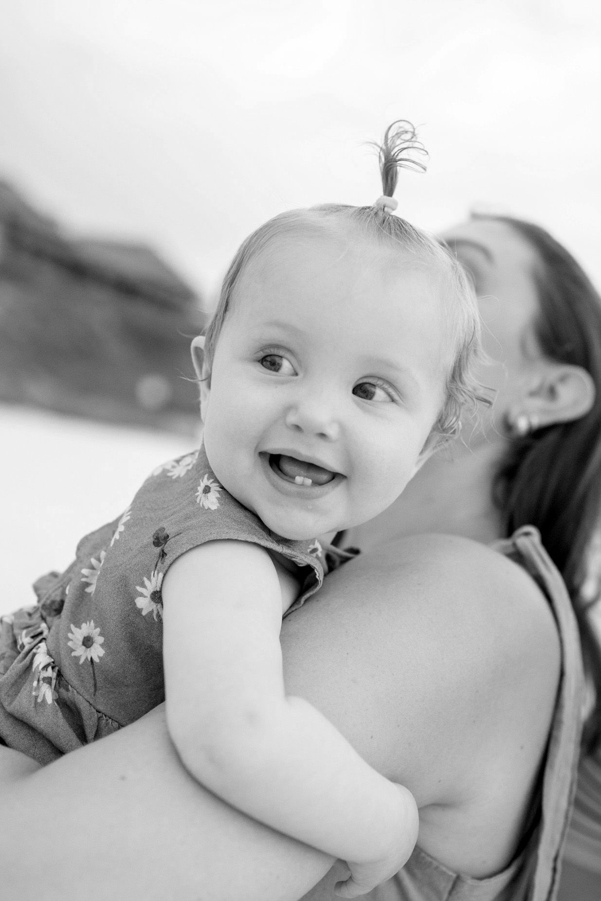 A baby smiling in Seaside beach
