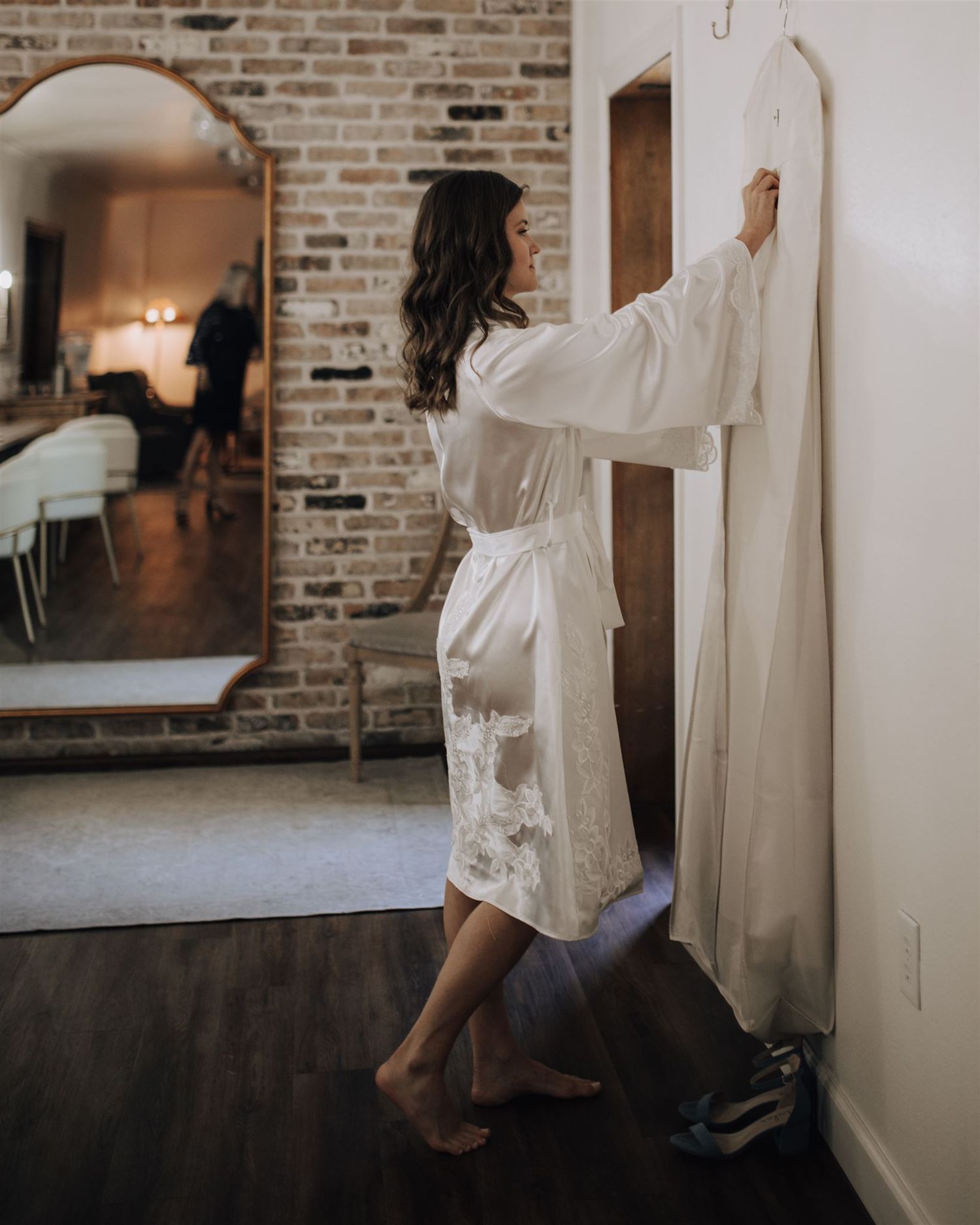 bride and bridesmaids getting ready in suite of Carriage House wedding venue in Conroe, Tx