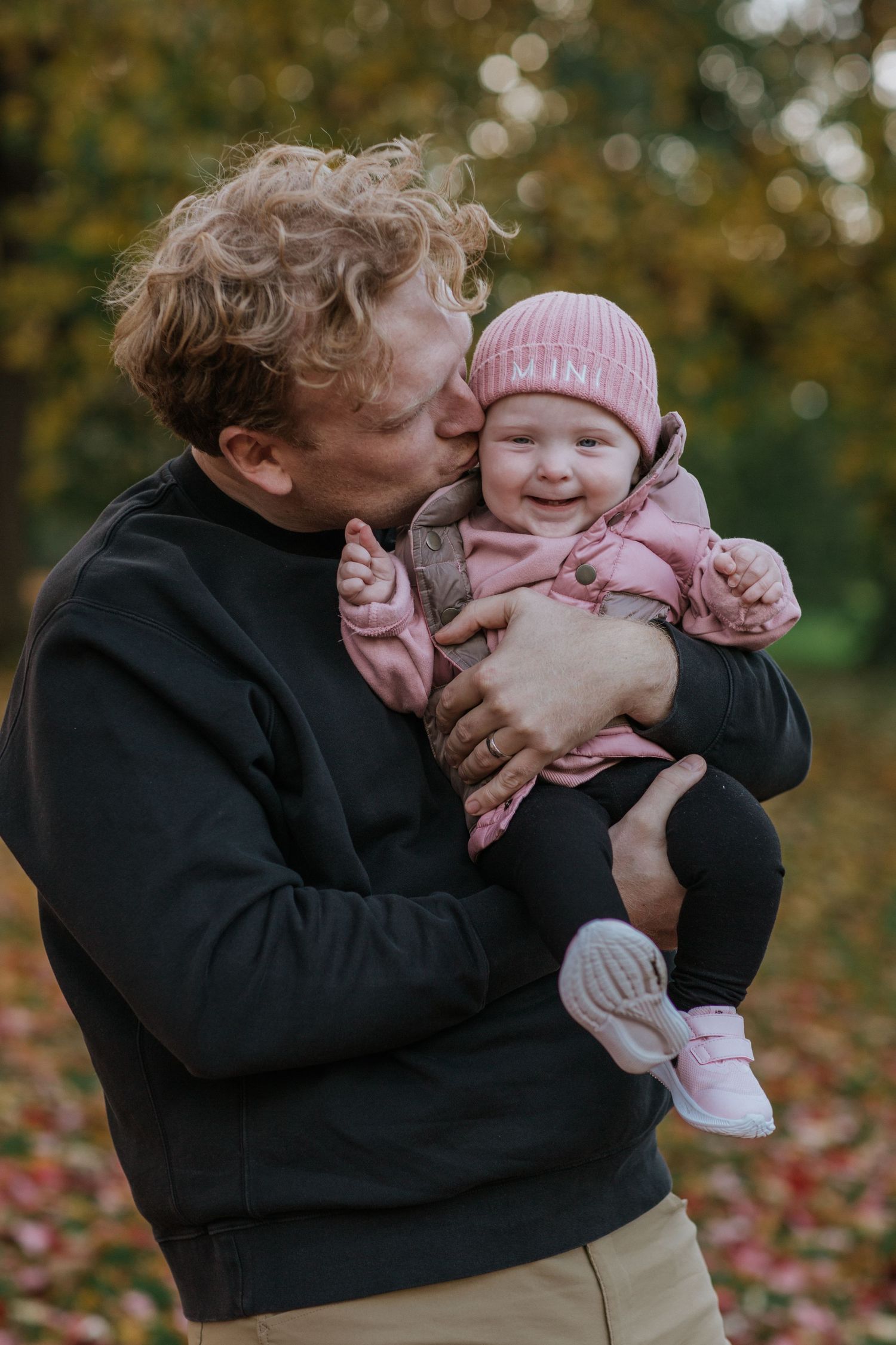 Playful family interactions captured in a series of candid fall portraits.