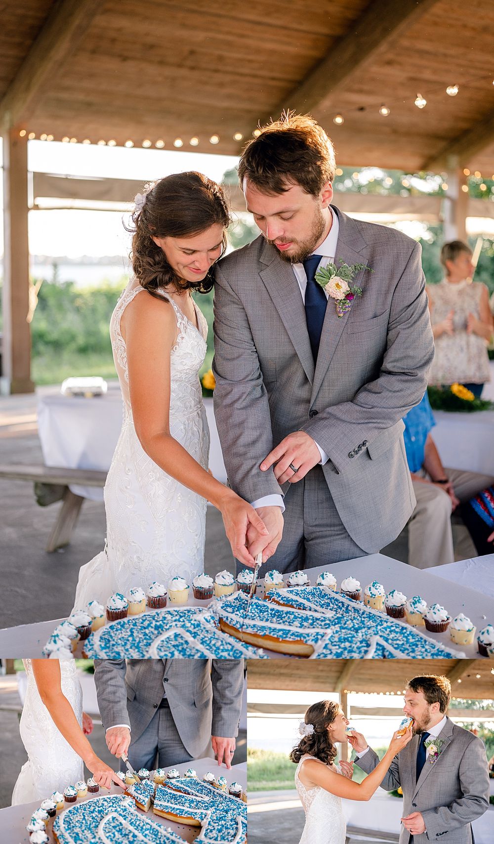 A wedding couple cuts into their blue and white wedding cake together under a rustic pavilion.