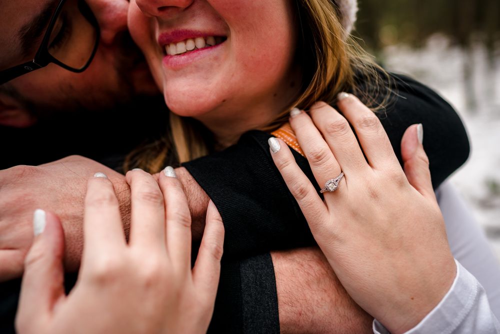 Close-up romantic moment captured during an engagement session.