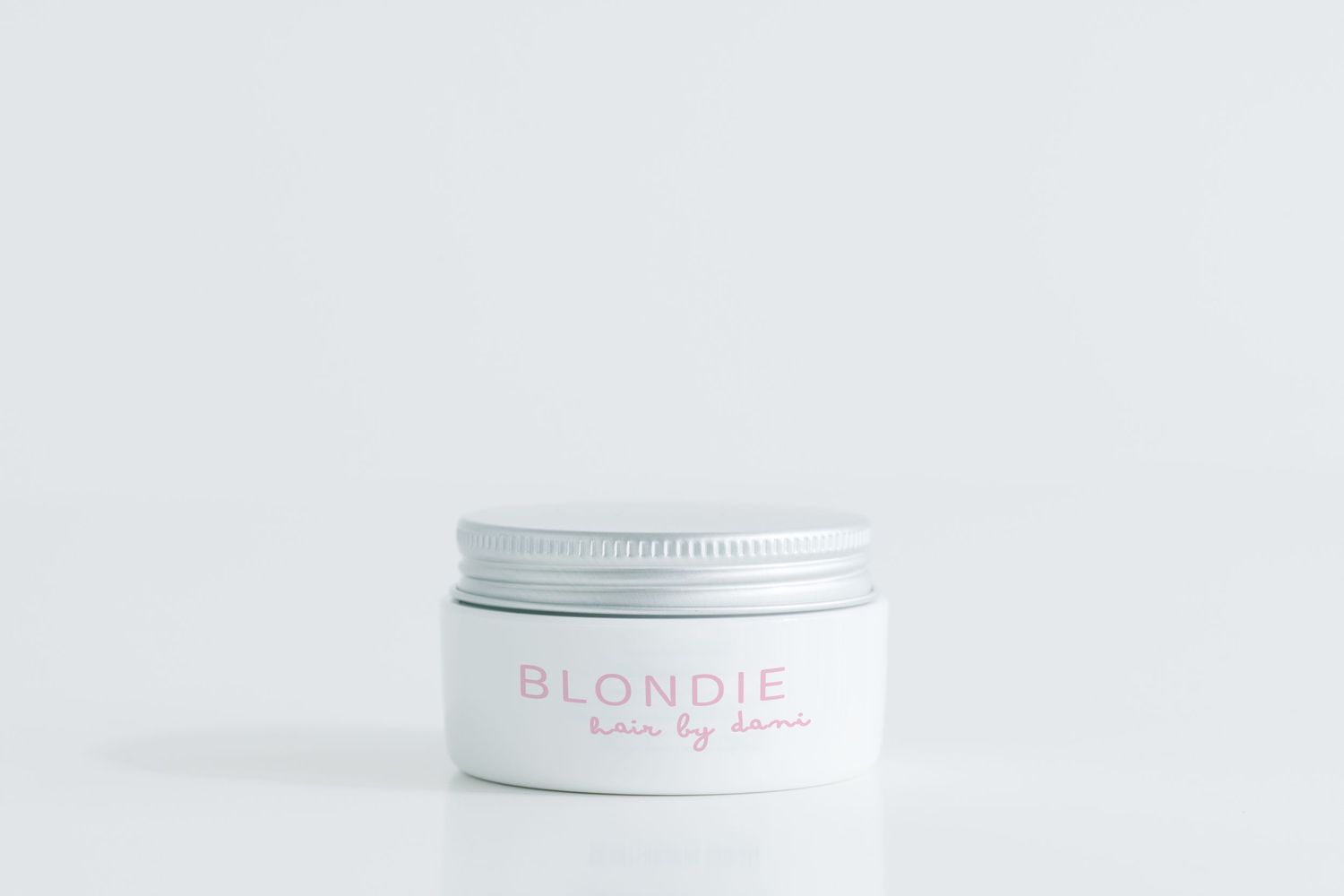 Clean white product container with Blondie branding on light background.
