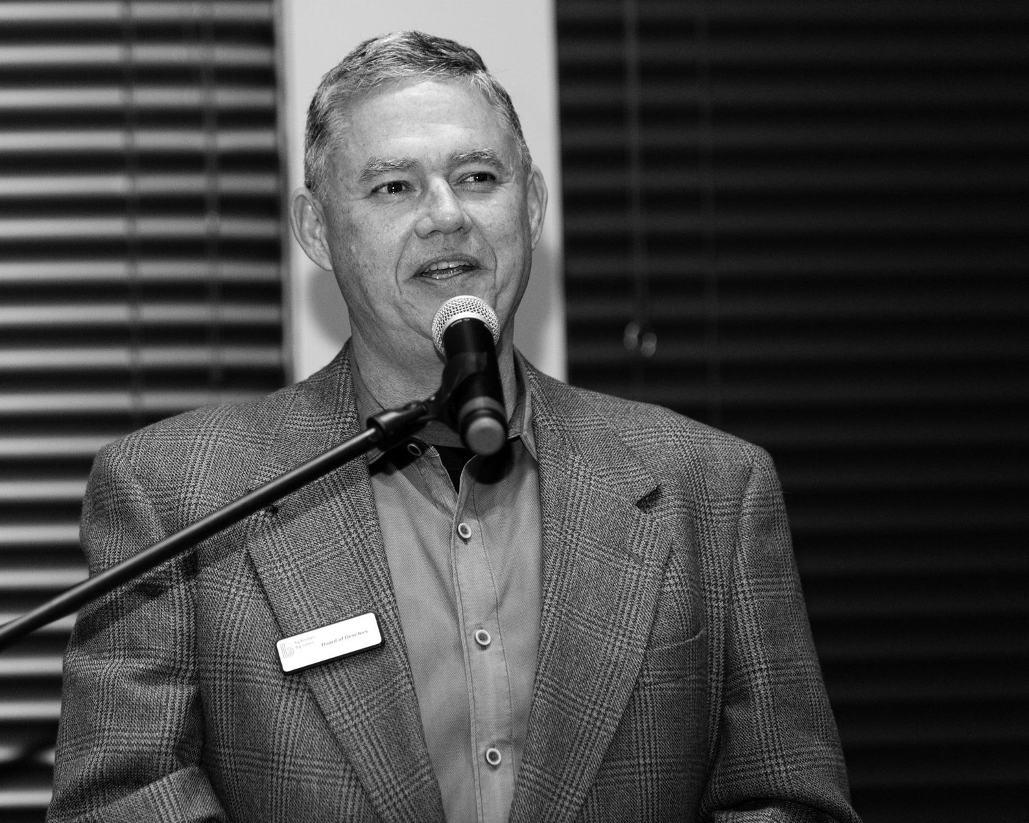 Corporate Photo of CEO speaking at event by best photographer