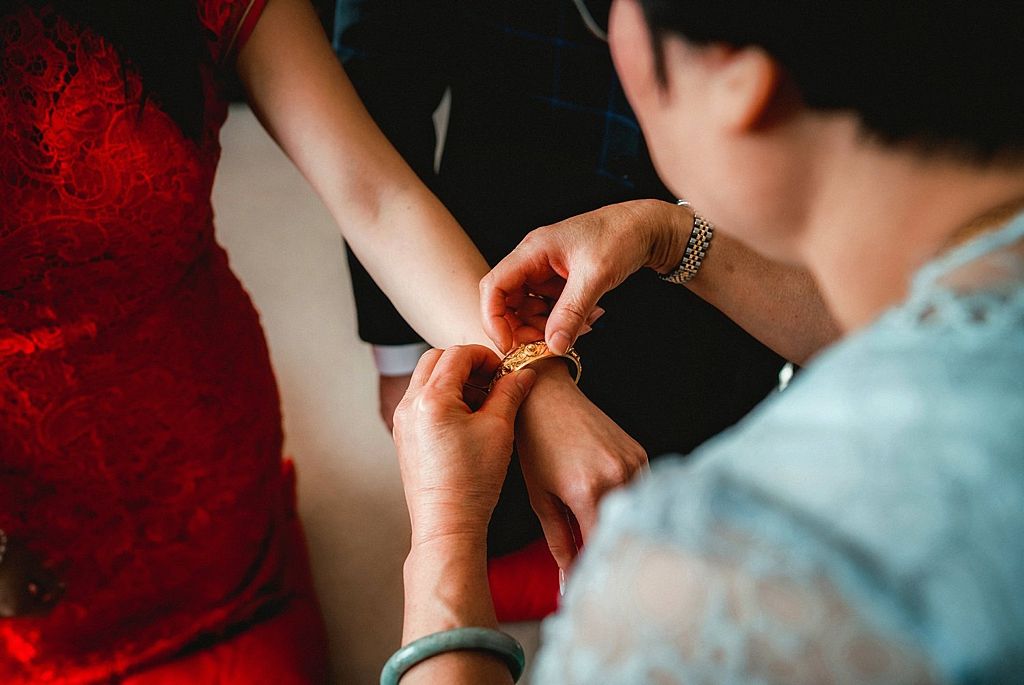 Close-up shots of tea ceremony details with hands and cups in dramatic lighting.