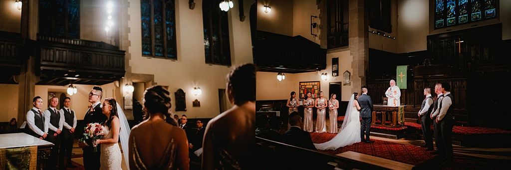 Wide shot of a wedding ceremony in a historic church with stained glass windows and wooden details.