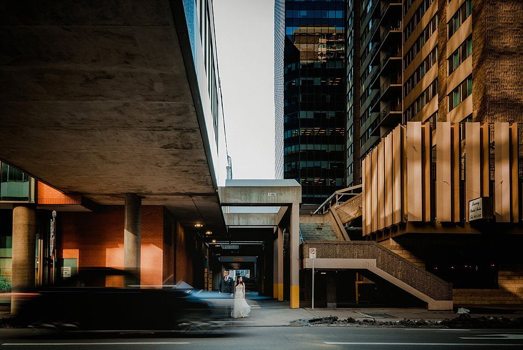 Modern urban architecture with dramatic lighting and concrete structures.