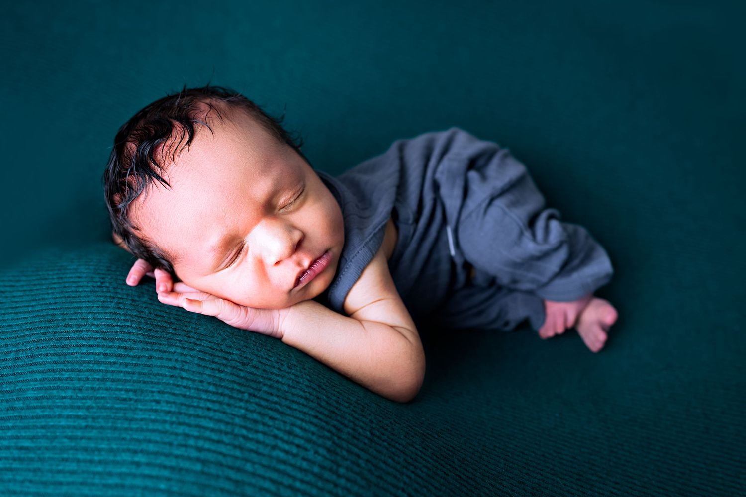 Boy on teal blanket - Newborn photography session in Clarksville TN
