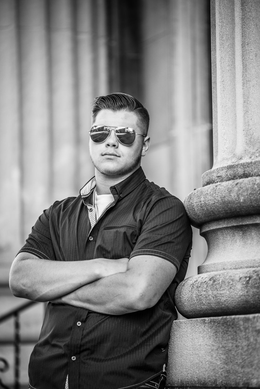 Senior guy with arms crossed and aviators