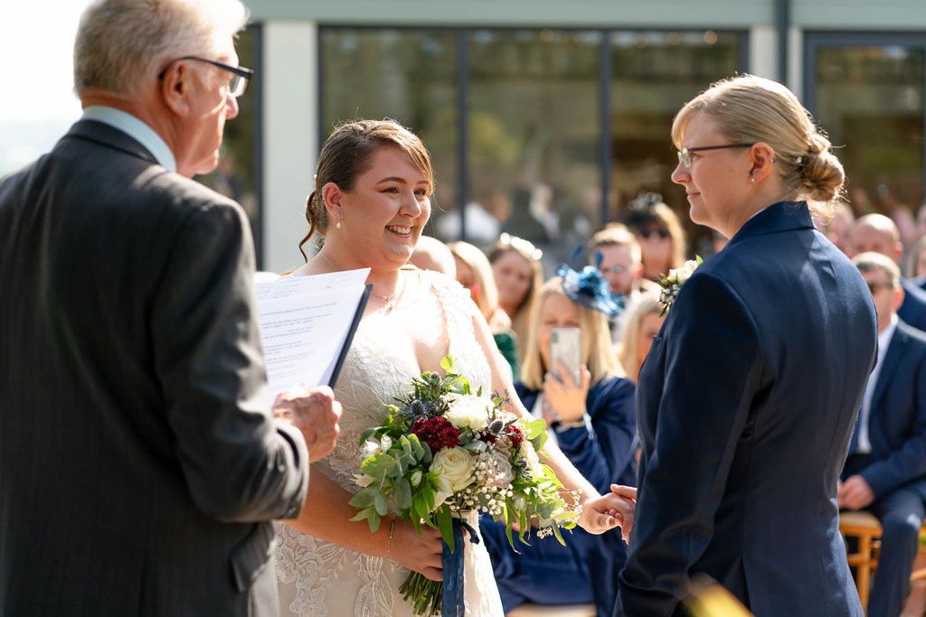 Two LGBTQ Brides during ceremony at Harefield Barn, Devon