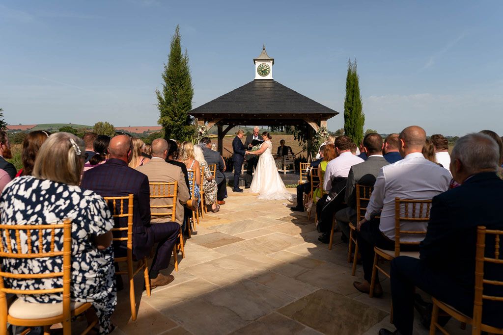 Wide angle view of two LGBTQ Brides at Harefield Barn, Devon