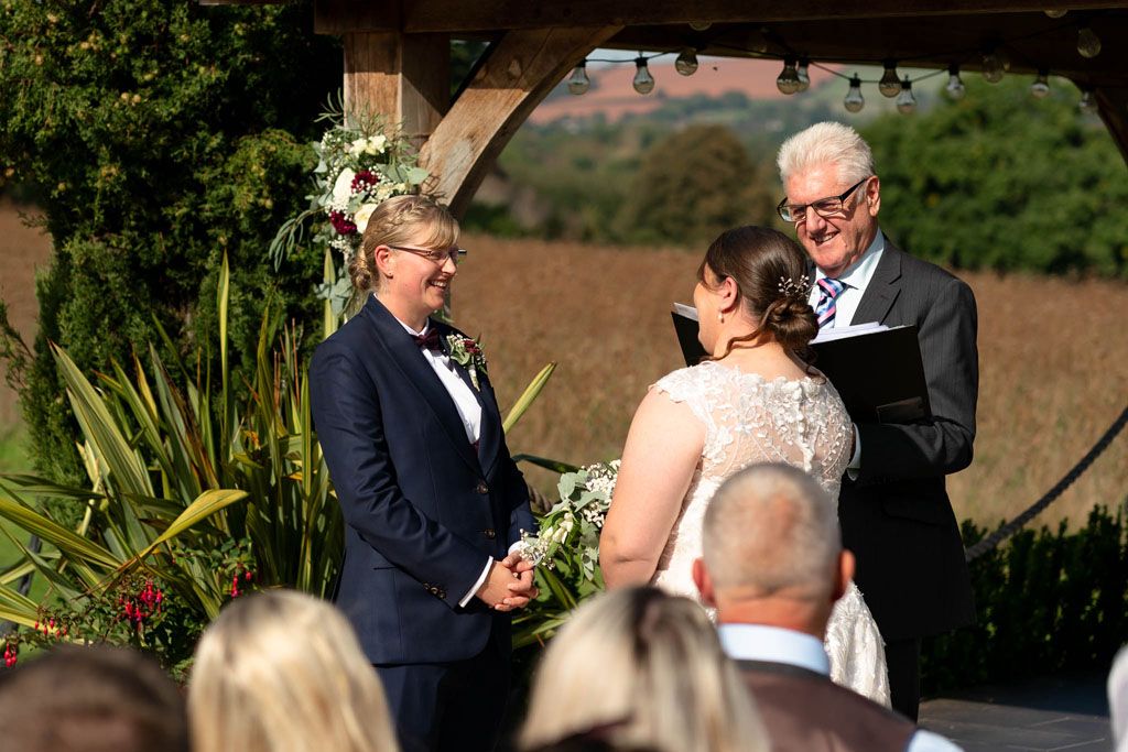 Wedding ceremony of two LGBTQ Brides at Harefield Barn, Devon