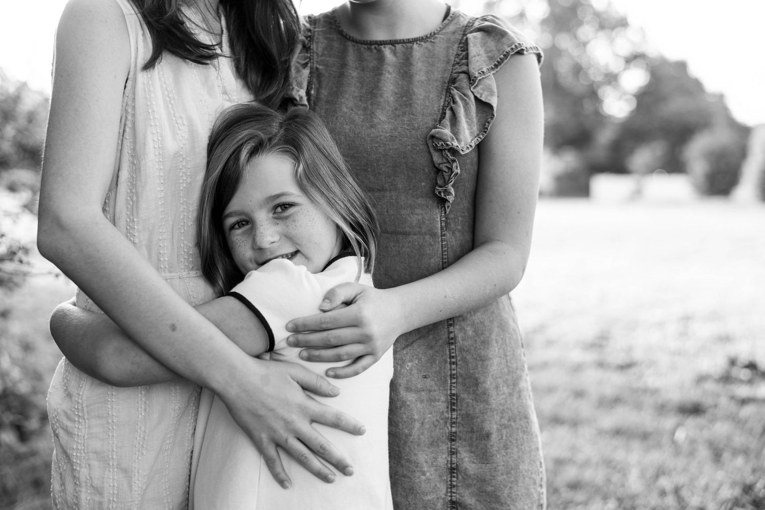 The relationship of three sisters photographed by St. Louis Photographer Isabel Nolan.