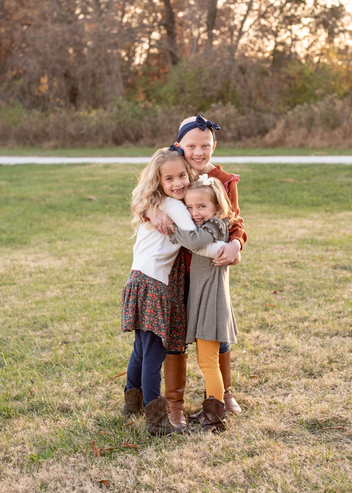 Three sisters in this photograph y by St. Louis Photographer Isabel Nolan.