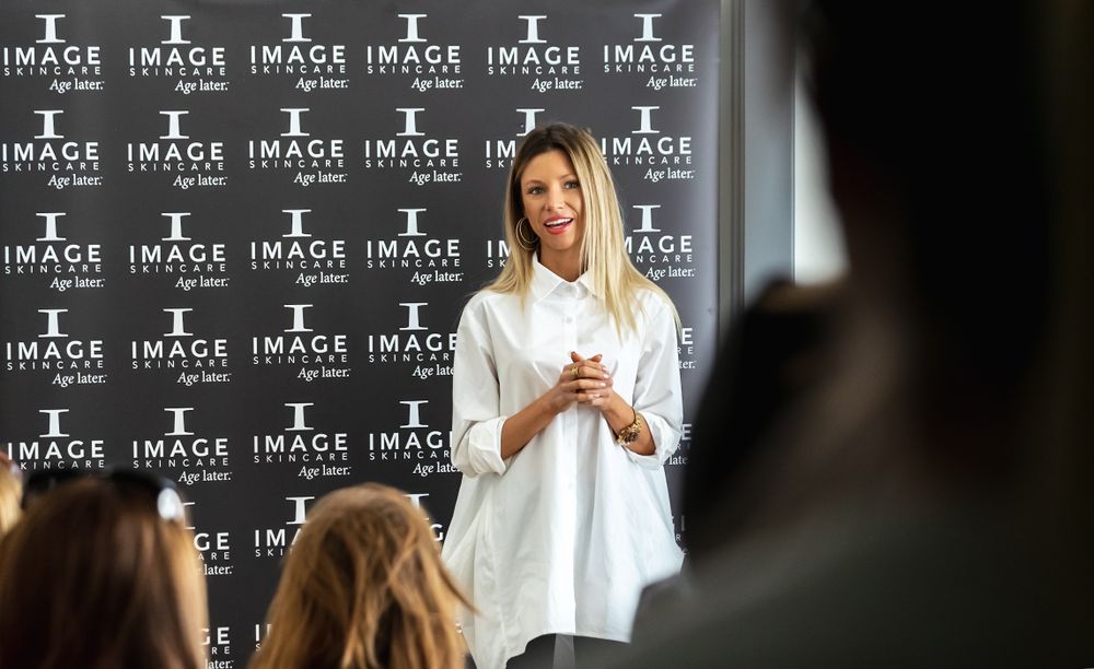 Business presentation setup with Image branding and logo backdrop.
