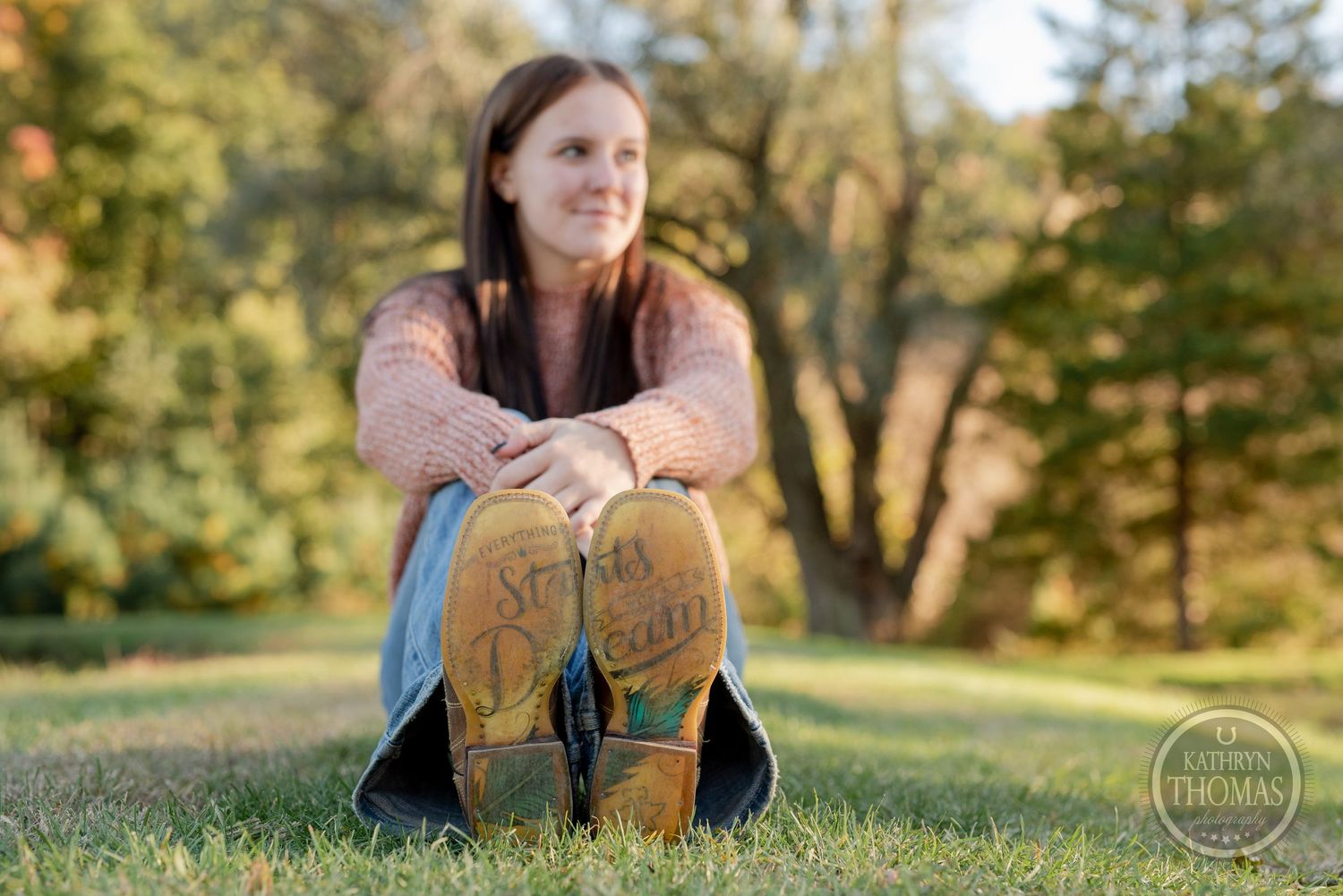 Autumn outdoor photo showing yellow boots and casual attire against a natural background.
