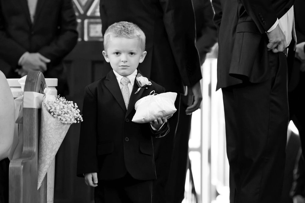 Ring bearer during wedding ceremony at Saint Mary Parish in Elyria, Ohio.