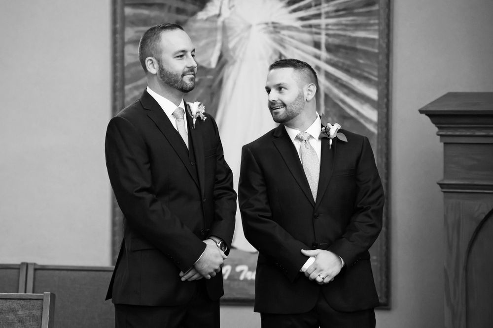 Groom and best man during wedding ceremony at Saint Mary Parish in Elyria, Ohio.