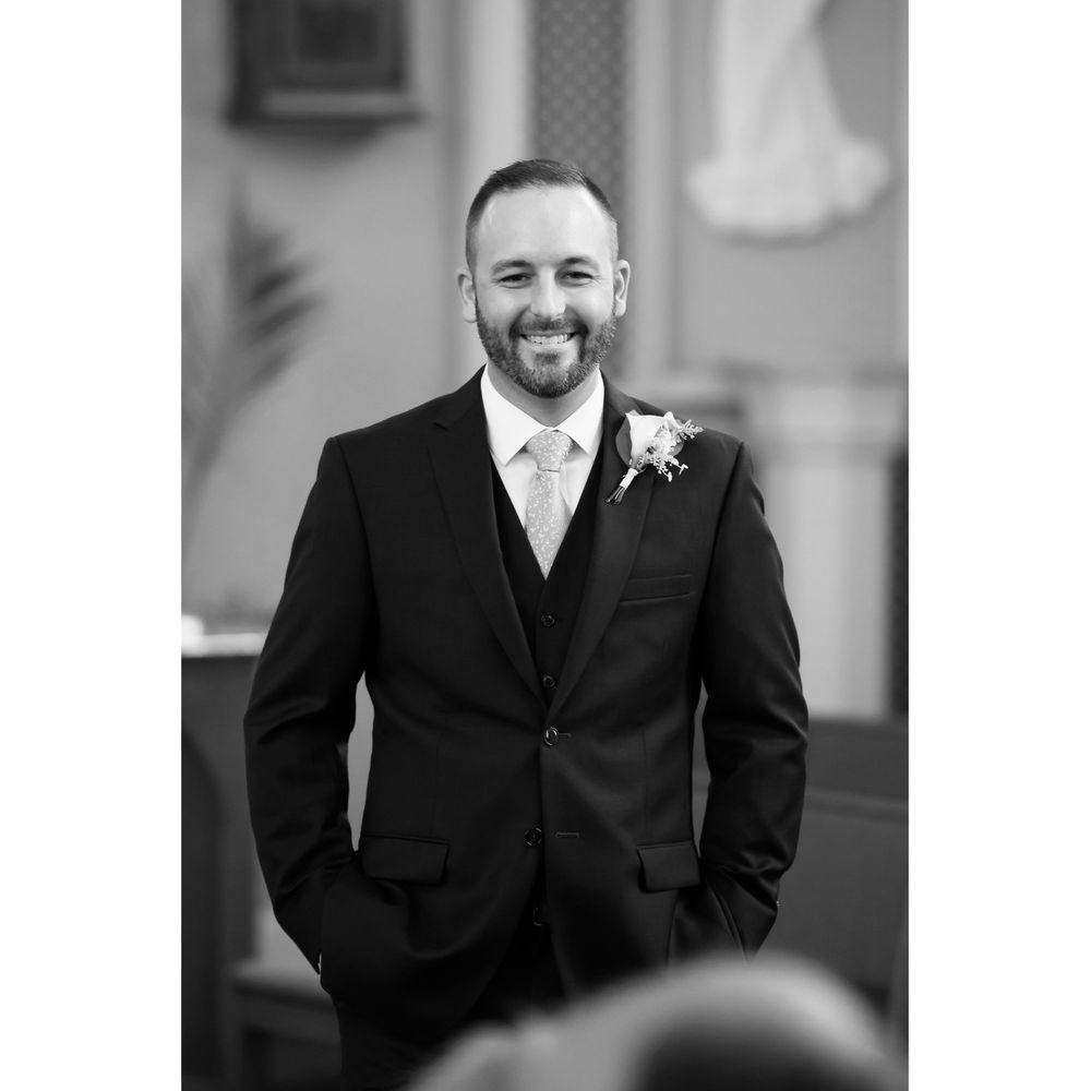 Groom sees his bride during wedding processional at Saint Mary Parish in Elyria, Ohio.