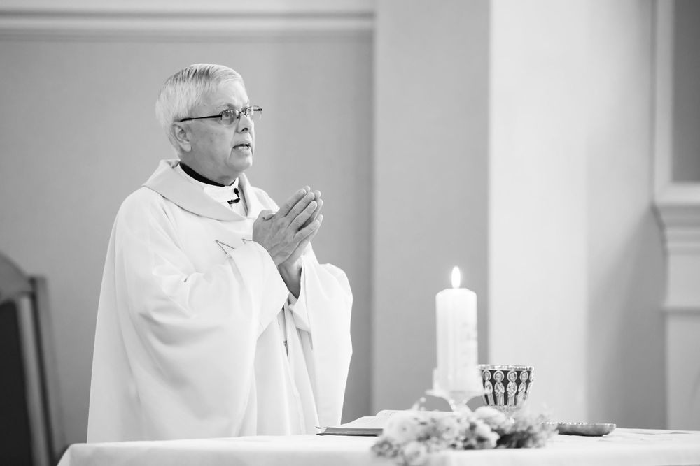 Priest begins wedding ceremony at Saint Mary Parish in Elyria, Ohio.