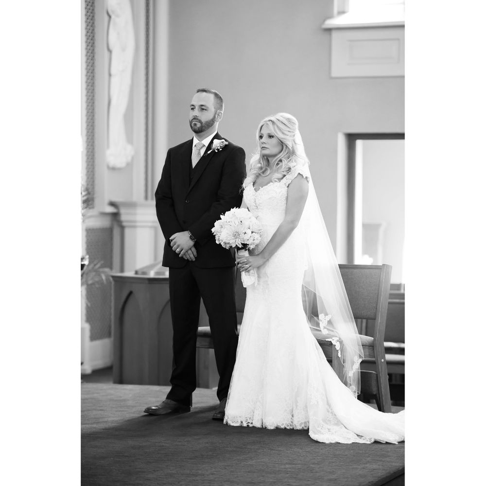 Bride and groom during wedding ceremony at Saint Mary Parish in Elyria, Ohio.