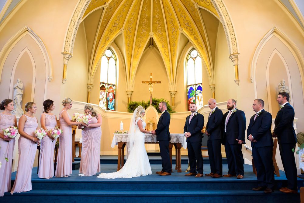 Bridal party on alter at Saint Mary Parish in Elyria, Ohio.