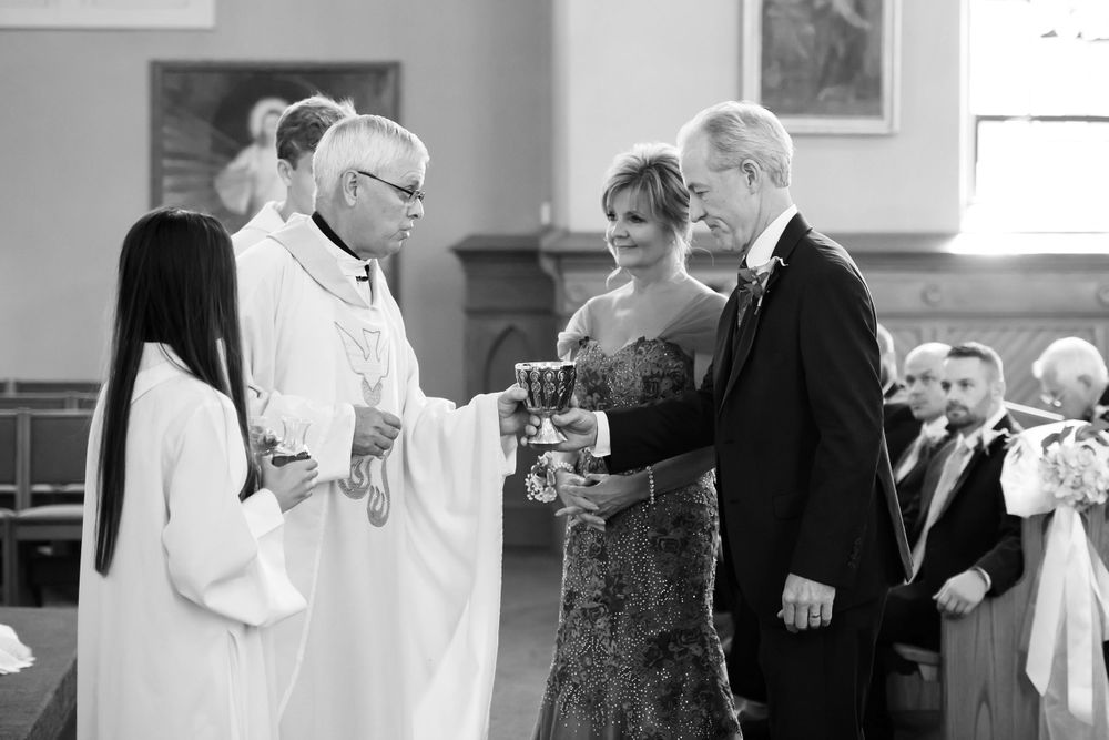 Parents deliver gifts during wedding ceremony at Saint Mary Parish in Elyria, Ohio.