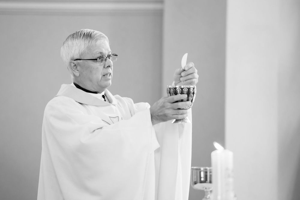 Grooms prepares communion at Saint Mary Parish in Elyria, Ohio.