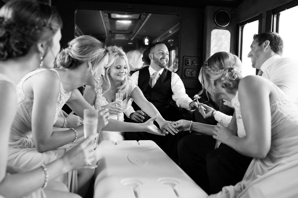Bride and groom jokingly show of wedding rings at Cleveland wedding.