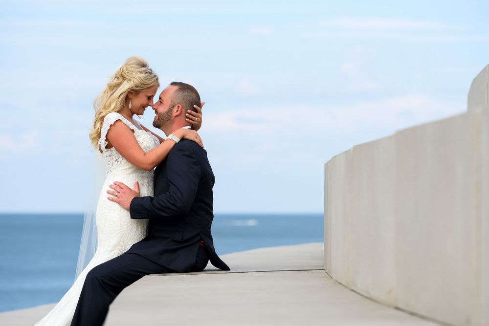Bride and groom embrace on Solstice Steps in Lakewood, Ohio.