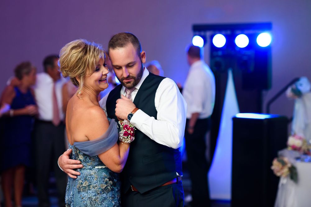 Grooms dances with his mother during wedding reception at Emerald Event Center in Cleveland, Ohio.