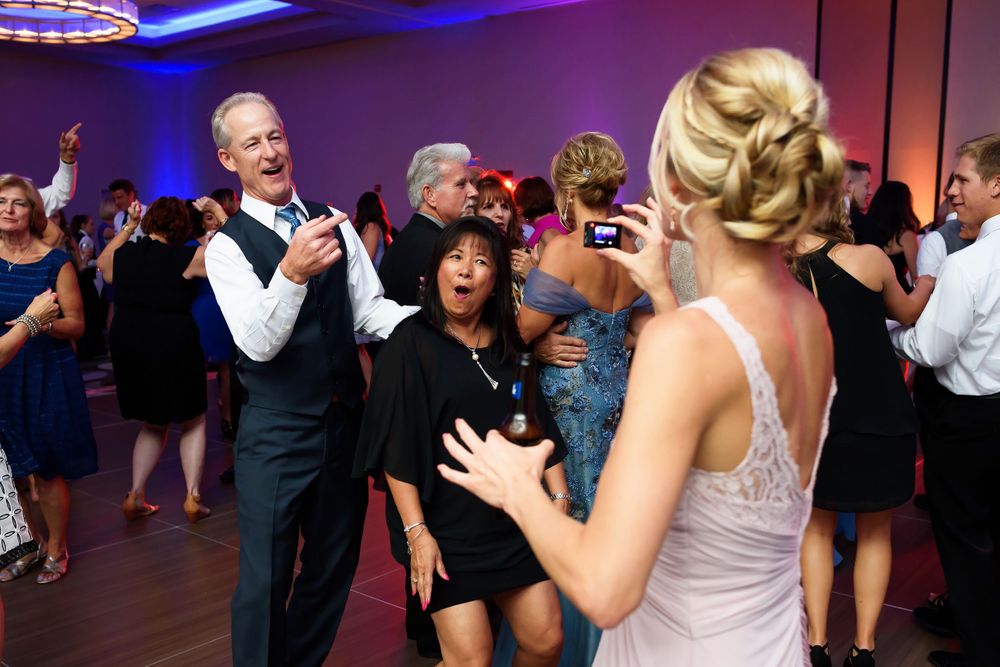 Bride's family having fun on dance floor during wedding reception at Emerald Event Center in Cleveland, Ohio.
