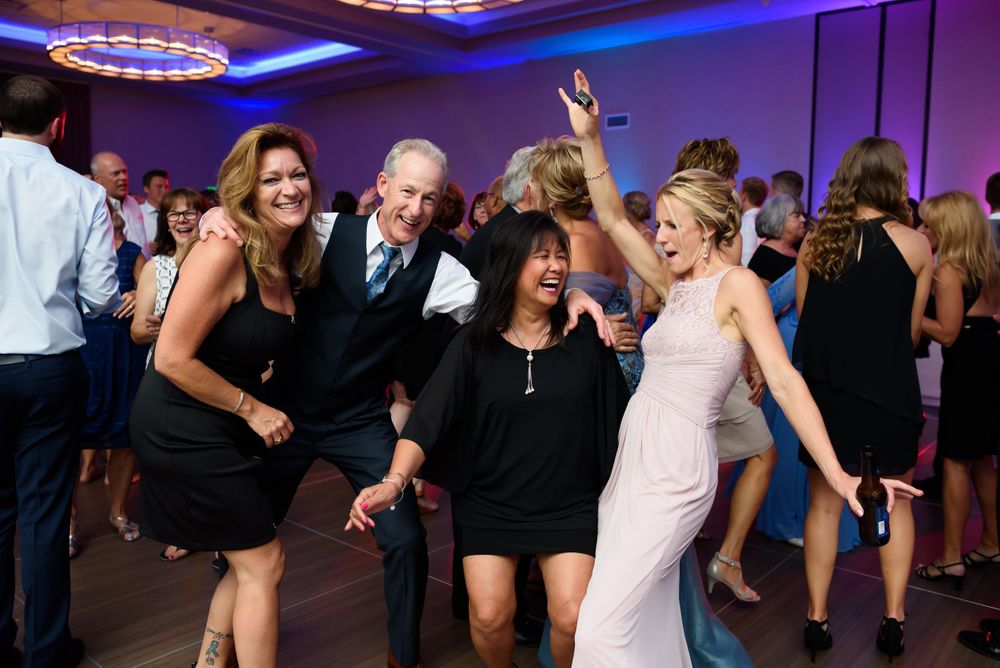 Guests on dance floor during wedding reception at Emerald Event Center in Cleveland, Ohio.
