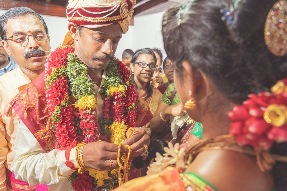 Traditional wedding ceremony with exchange of garlands and rituals in South Indian style.