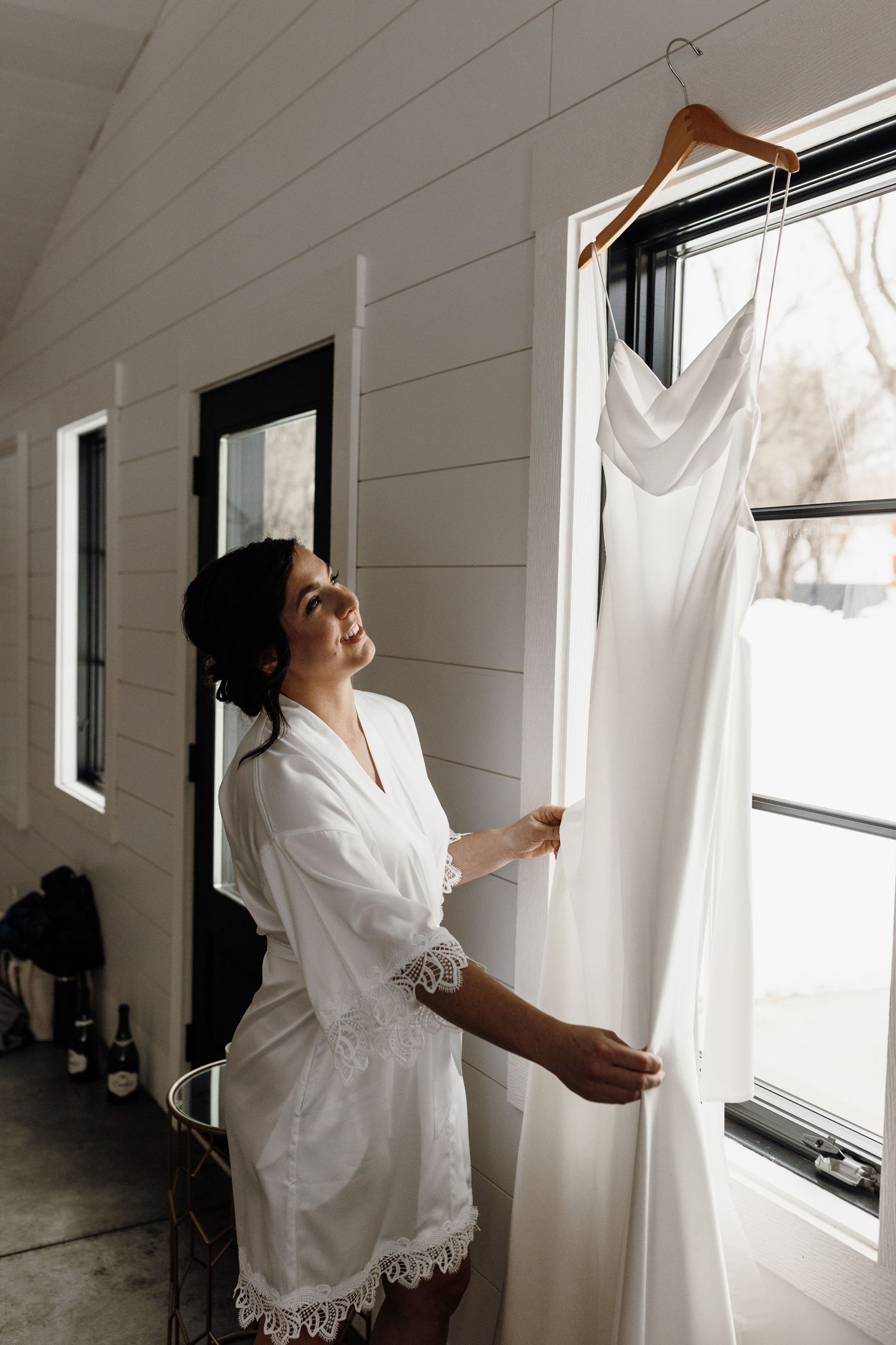 Bride looks at dress at LaPointe Events