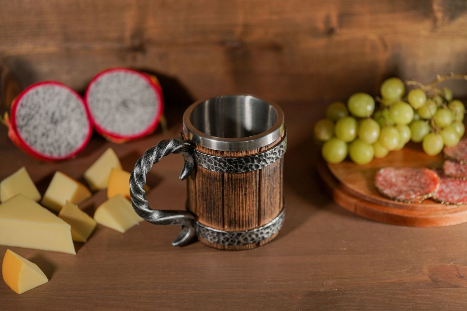 product photo of a viking mug with fruit, meat, and cheese