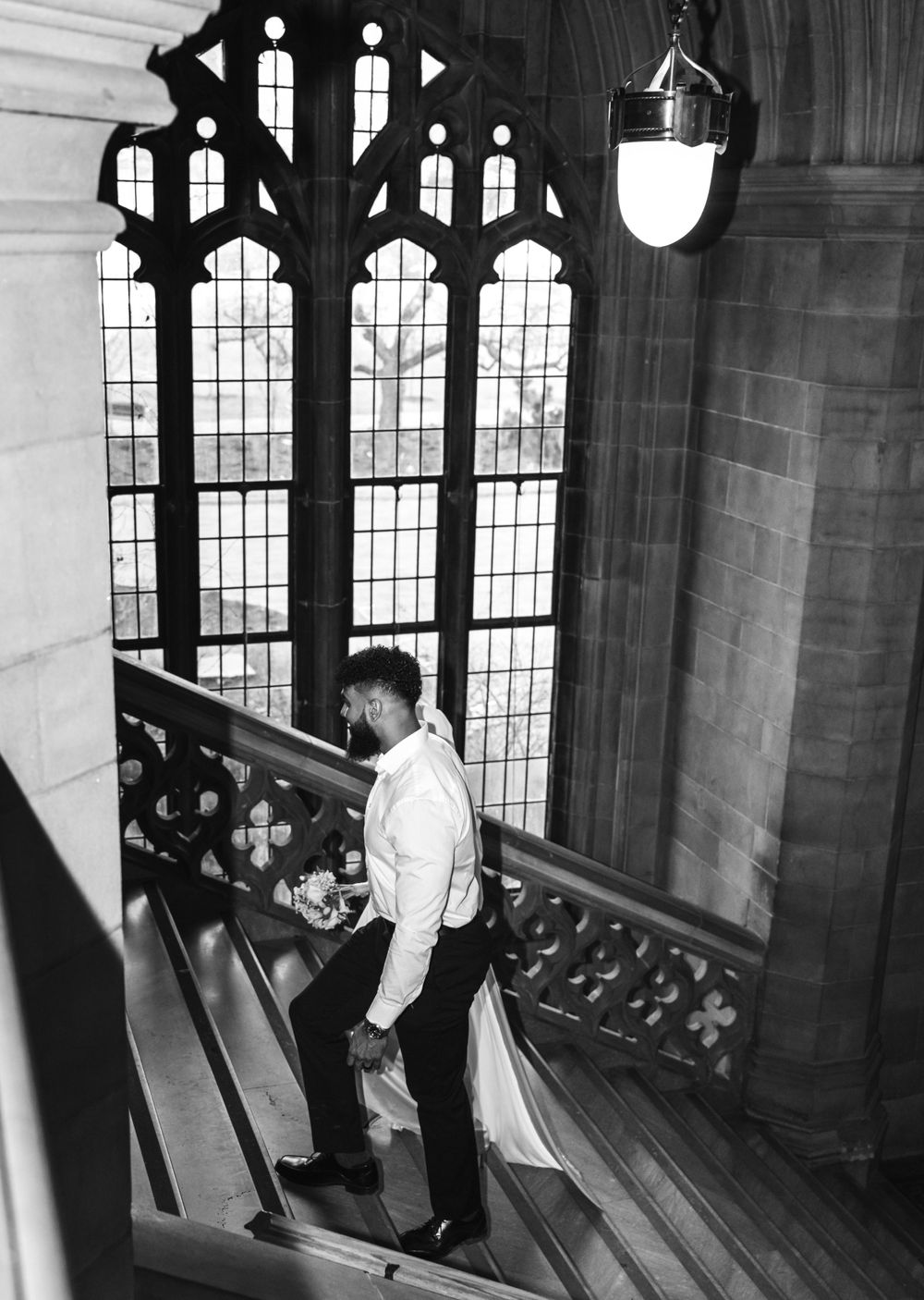 Documentary wedding photo of couple walking in Toronto college