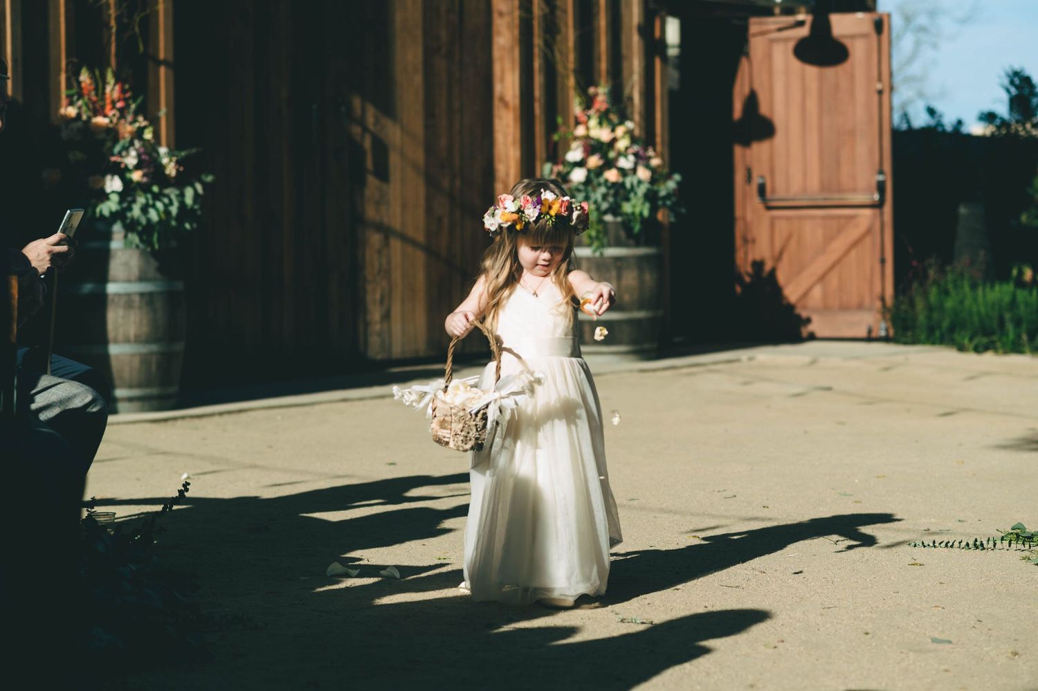 flower girl walking down the aisle