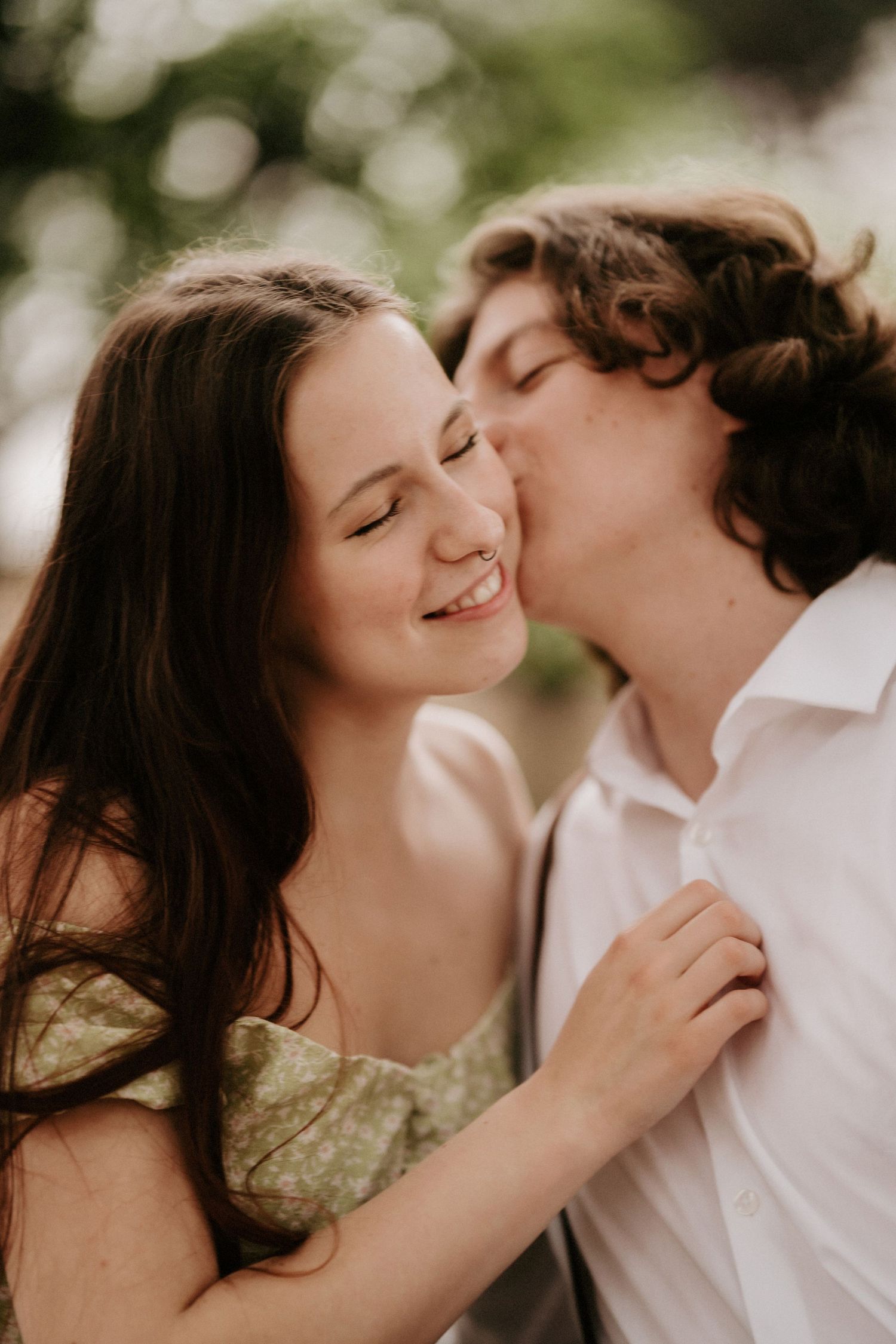 Intimate close-up portraits of couple sharing romantic moments in natural lighting.
