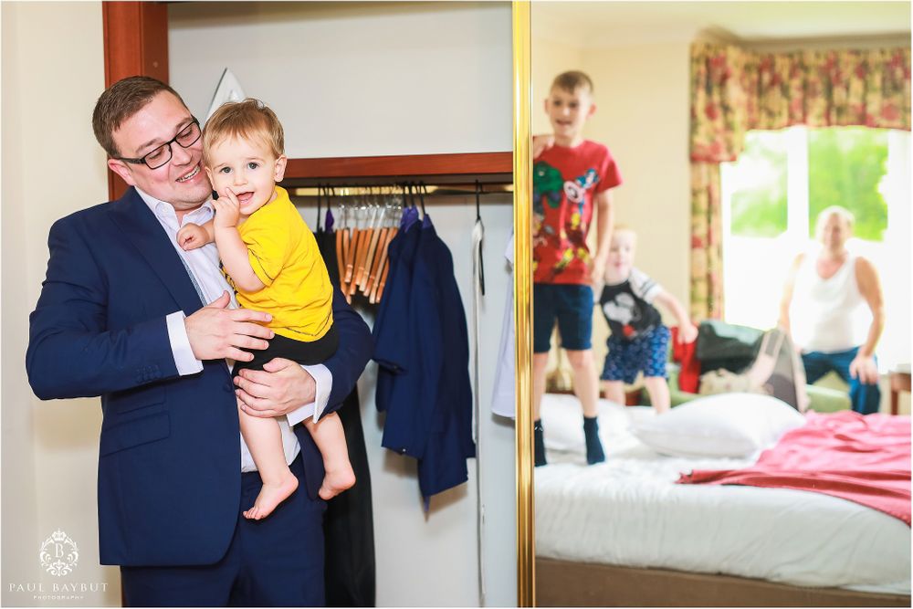 Formal gathering in a home with people in business attire.