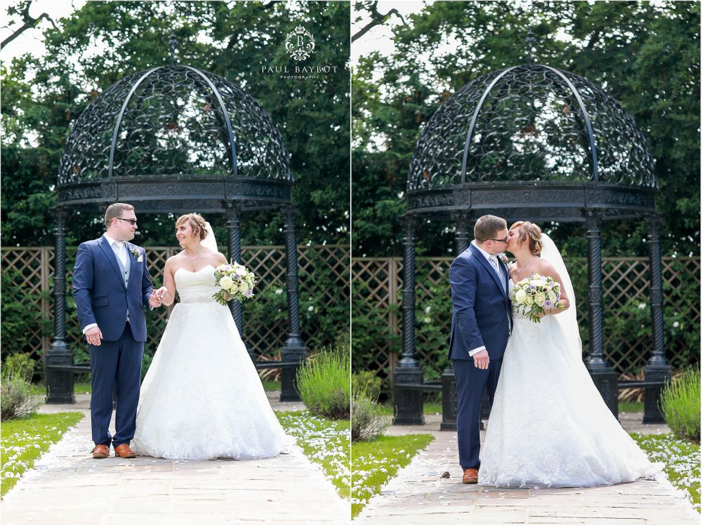 Romantic wedding couple poses under ornate garden arbor in two matching shots.