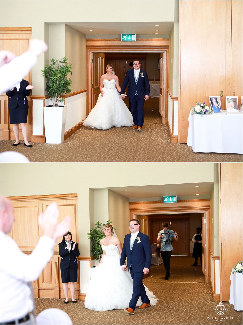 Wedding couple making grand entrance into reception hall while guests applaud.